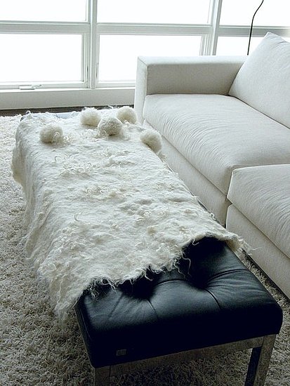 This Wool Felt and Pom Pom Throw ($295) will add some organic coziness to an otherwise minimalist room. The felt throw is made of alpaca, wool, and lincoln longwool. This Wool Felt and Pom Pom Throw ($295) will add some organic coziness to an otherwise minimalist room. The felt throw is made of alpaca, wool, and lincoln longwool.
