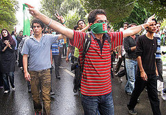 Front Page: Iranians Clash as Ahmadinejad Denies Holocaust 
