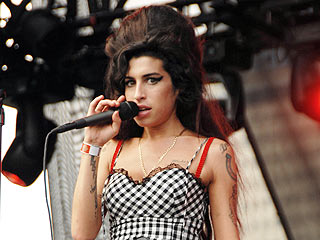 Amy Winehouse Won't Attend Grammys but Will Perform