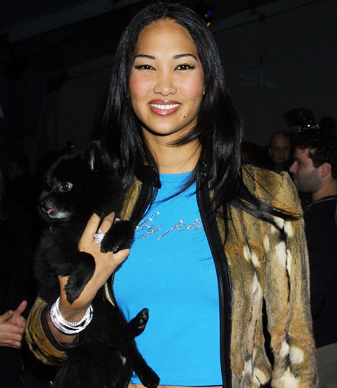 Model Kimora Lee Simmons with her dog, Zoe, attend the Sean John Fall 2001 collection show at New York's Fashion Week on Februar Model Kimora Lee Simmons with her dog, Zoe, attend the Sean John Fall 2001 collection show at New York's Fashion Week on Februar