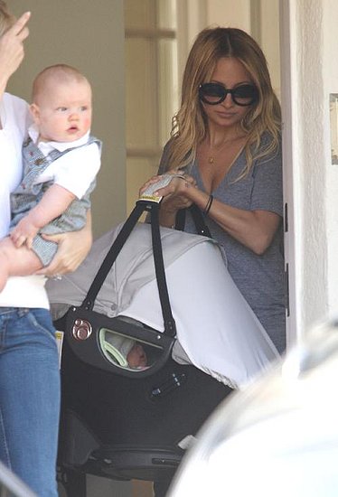 Nicole and baby Harlow leaving a party. Nicole and baby Harlow leaving a party.