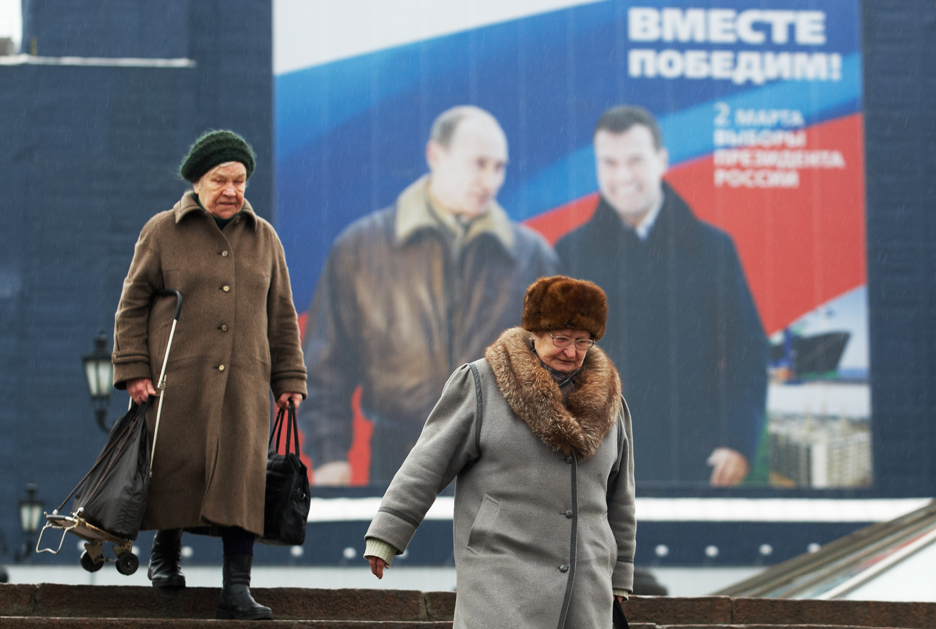 Putin with likely successor Dmitry Medvedev. Poster says "Together we will win!" Putin with likely successor Dmitry Medvedev. Poster says "Together we will win!"