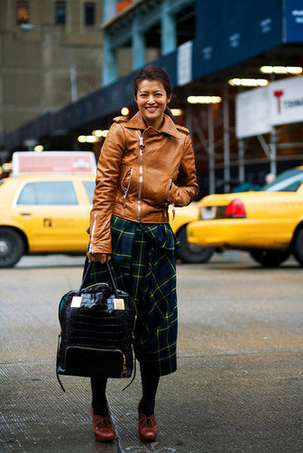 A stylish vision in plaid and leather.