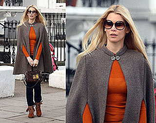Claudia Schiffer in London Wearing a Cape and Moccasins