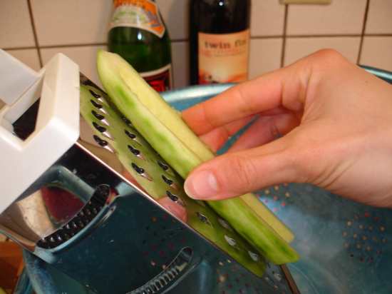 Grating the cucumber (a microplane grater works better) Grating the cucumber (a microplane grater works better)