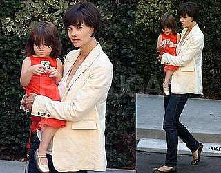 Photos of Katie Holmes and Suri Cruise Holding $100 Bill