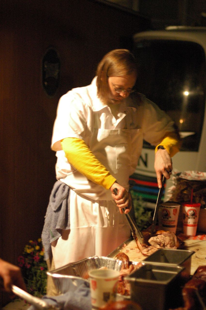 Wylie slices up pork at the David Chang party. Wylie slices up pork at the David Chang party.
