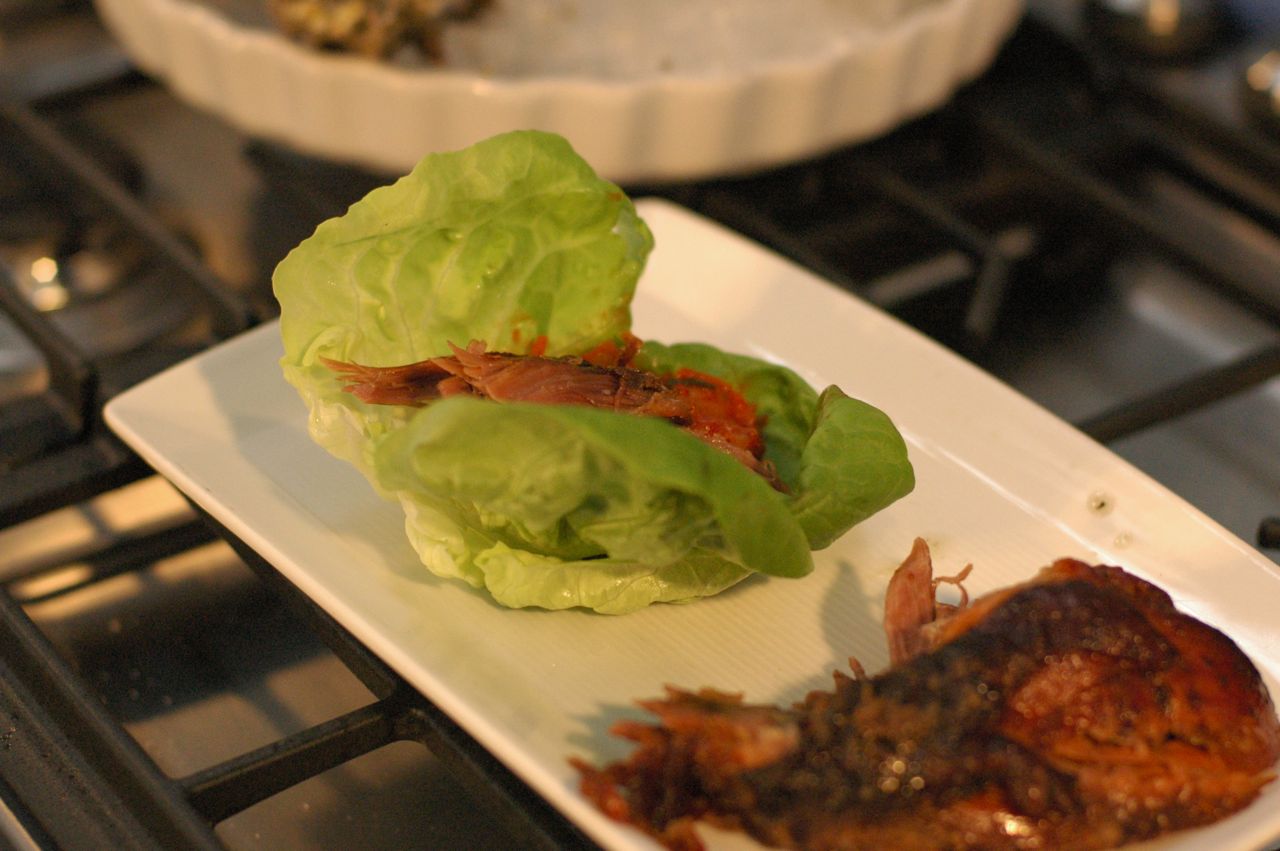Rocco taught me how to assemble one of David Chang's lettuce wraps: fill the lettuce with the Korean barbecued beef, top with ki Rocco taught me how to assemble one of David Chang's lettuce wraps: fill the lettuce with the Korean barbecued beef, top with ki