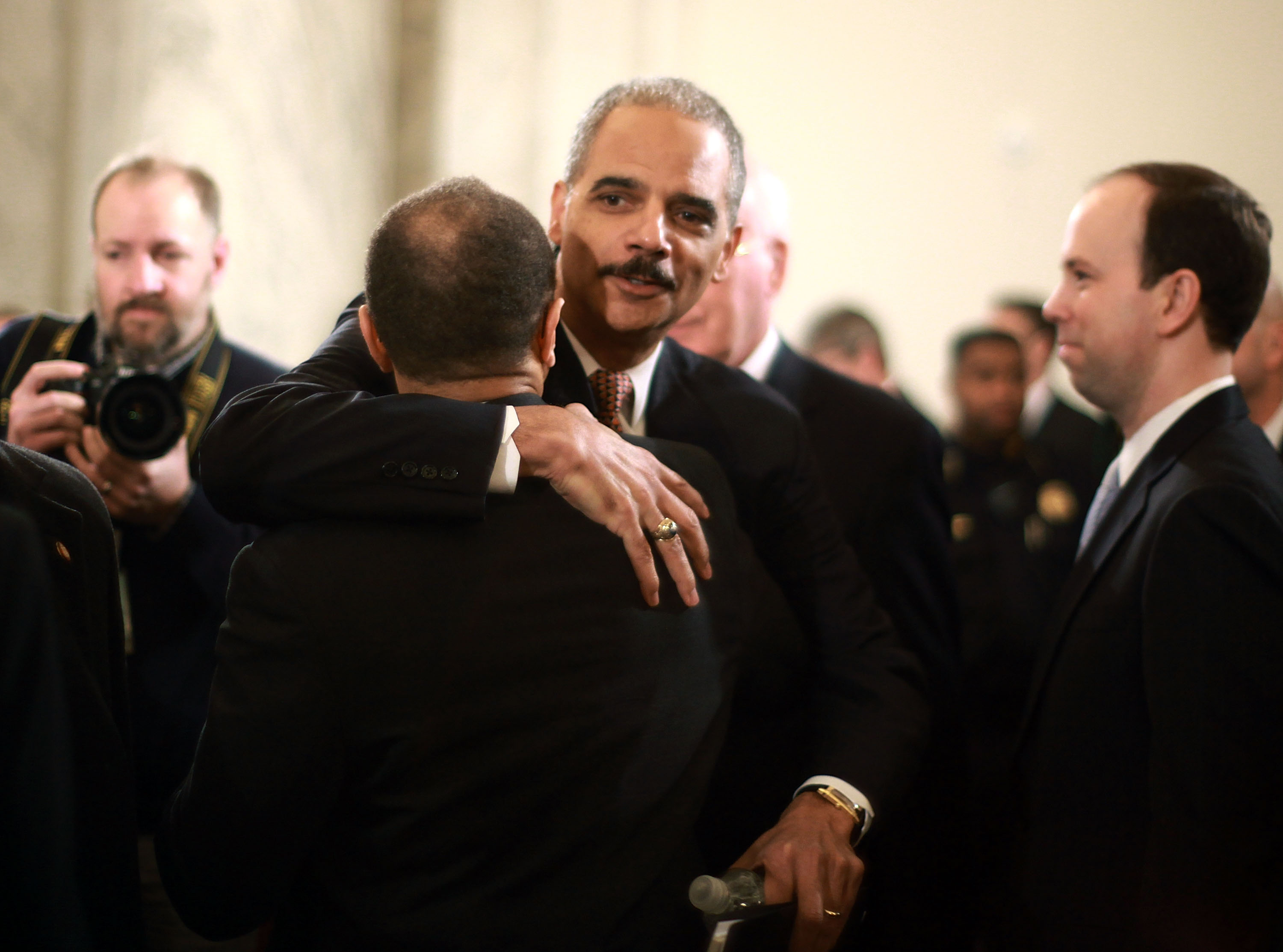 Attorney General nominee Eric Holder gives a supporter a hug.<br />
Attorney General nominee Eric Holder gives a supporter a hug.<br />