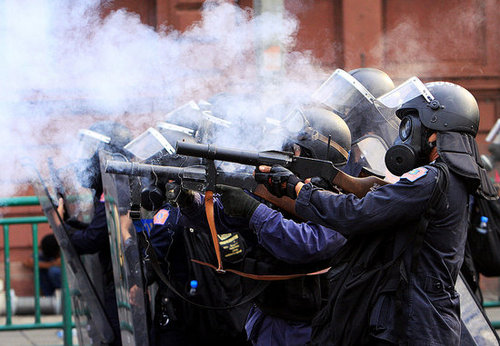 Front Page: Protesters Trap Thai Legislators, Fed Considers Plan to Buy Debt, Report of Western Plane Down