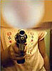 Dad Forces Six-Year-Old to Pose With Pistol For Pictures