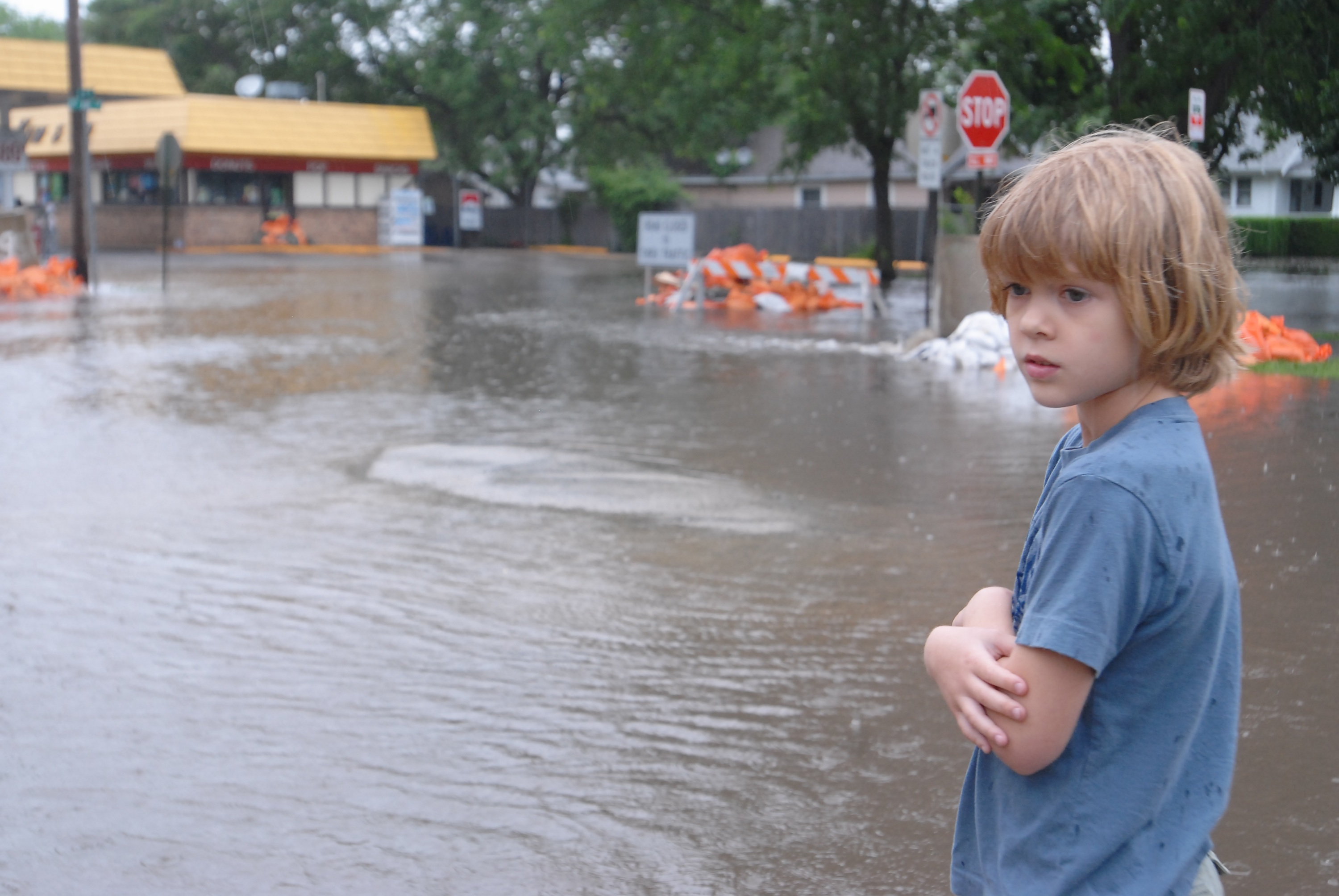 Eight year old Sammy Petersen watches as rising water inundates the low lying area of the Czech Village. Eight year old Sammy Petersen watches as rising water inundates the low lying area of the Czech Village.