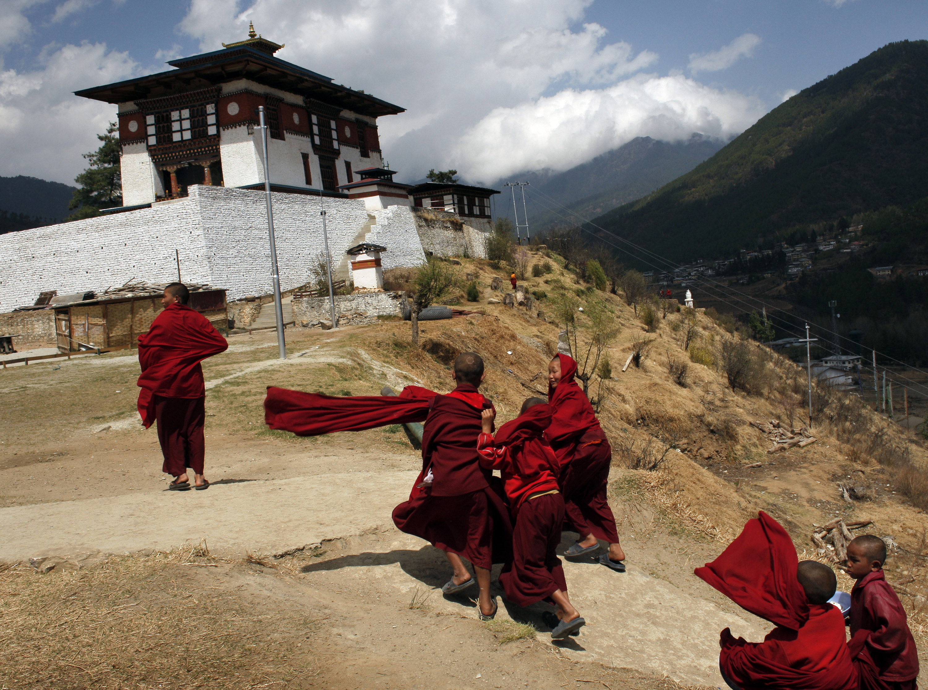 Young monks walk back to class after lunch. Young monks walk back to class after lunch.