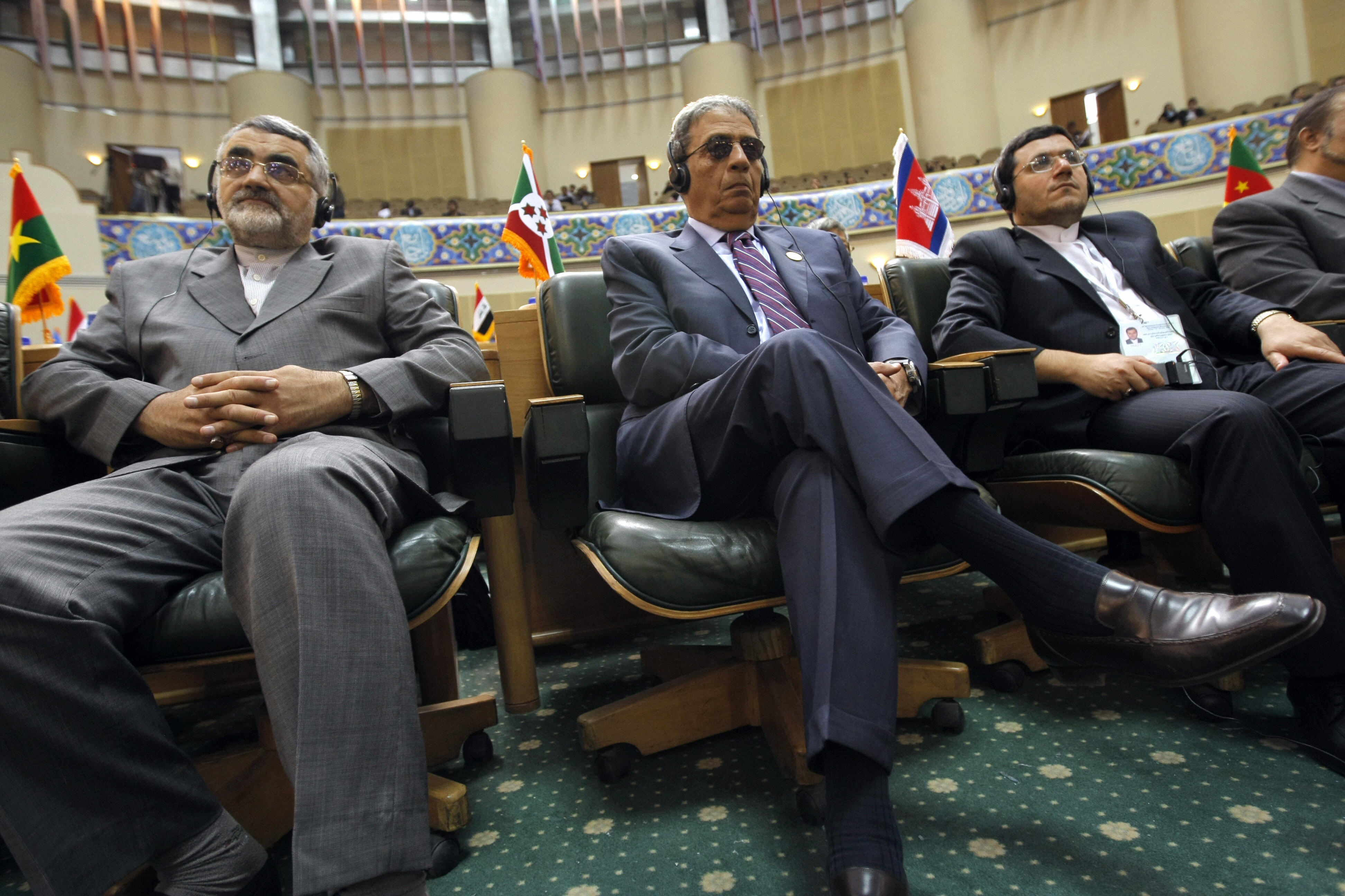 Arab League Secretary General Amr Mussa and Iranian prominent MP, Alaeddin Boroujerdi listen to the speech. Arab League Secretary General Amr Mussa and Iranian prominent MP, Alaeddin Boroujerdi listen to the speech.
