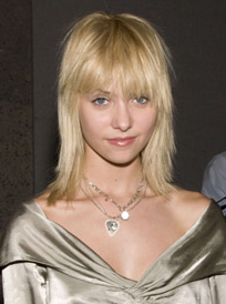 Photo of Gossip Girl Actress Taylor Momsen with Bangs New Fringe Hair at New York Fashion Week. Bleach Blonde Mullet Style Trend