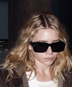 Photo of Ashley Olsen Twins at Heathrow Airport. Scruffy Hair. Love or Hate?