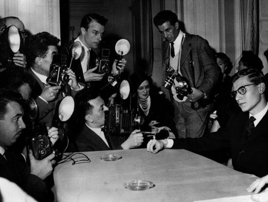1957: 21-year-old Yves Saint Laurent at a press conference, shortly after being announced as the new chief designer of Christian
