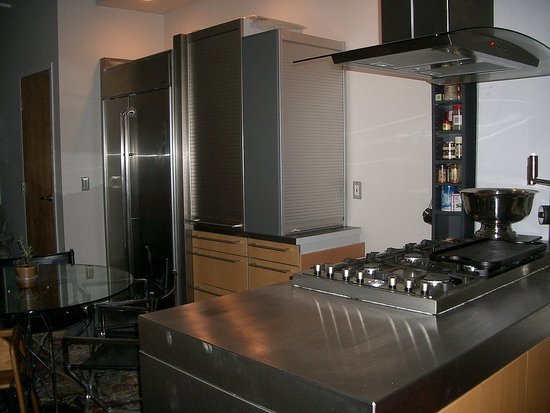 We added stainless countertops, painted the walls a warm greige color and added in beautiful swiss pear cabinetry from Bulthaup.