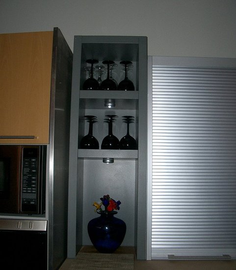 We placed this shelving unit from Bulthaup next to the sink and storage unit.