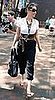 Lucy Liu Leaves NYC Kabbalah Center Wearing Thick Leather Tie Belt