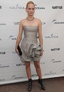 Amber Valletta Attends World Oceans Day in Silver Strapless Oscar de la Renta Origami Dress and Black Peep-toe Booties