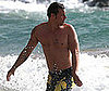 Slide Photo of Justin Chambers Shirtless in Hawaii Wearing Yellow Floral Board Shorts