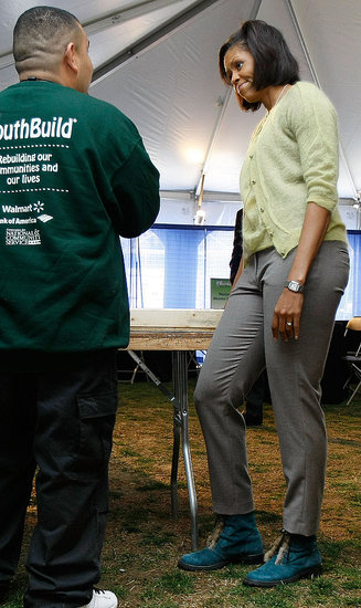 First Lady Michelle Obama wears green from head to toe, while touring an energy-efficient home construction project.
First Lady Michelle Obama wears green from head to toe, while touring an energy-efficient home construction project.