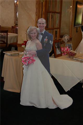 I didn't want to wear my wedding dress to the reception, but lots of people had wanted to see "a life size me" in it- so my parents made a cardboard cutout of my husband and me on our wedding day. Hilarious! I didn't want to wear my wedding dress to the reception, but lots of people had wanted to see "a life size me" in it- so my parents made a cardboard cutout of my husband and me on our wedding day. Hilarious!