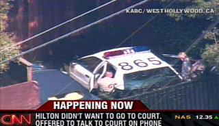 Paris Update: She's In Handcuffs, On Her Way to the Courthouse