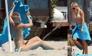 Mena Is Nearly Bald And In A Bikini